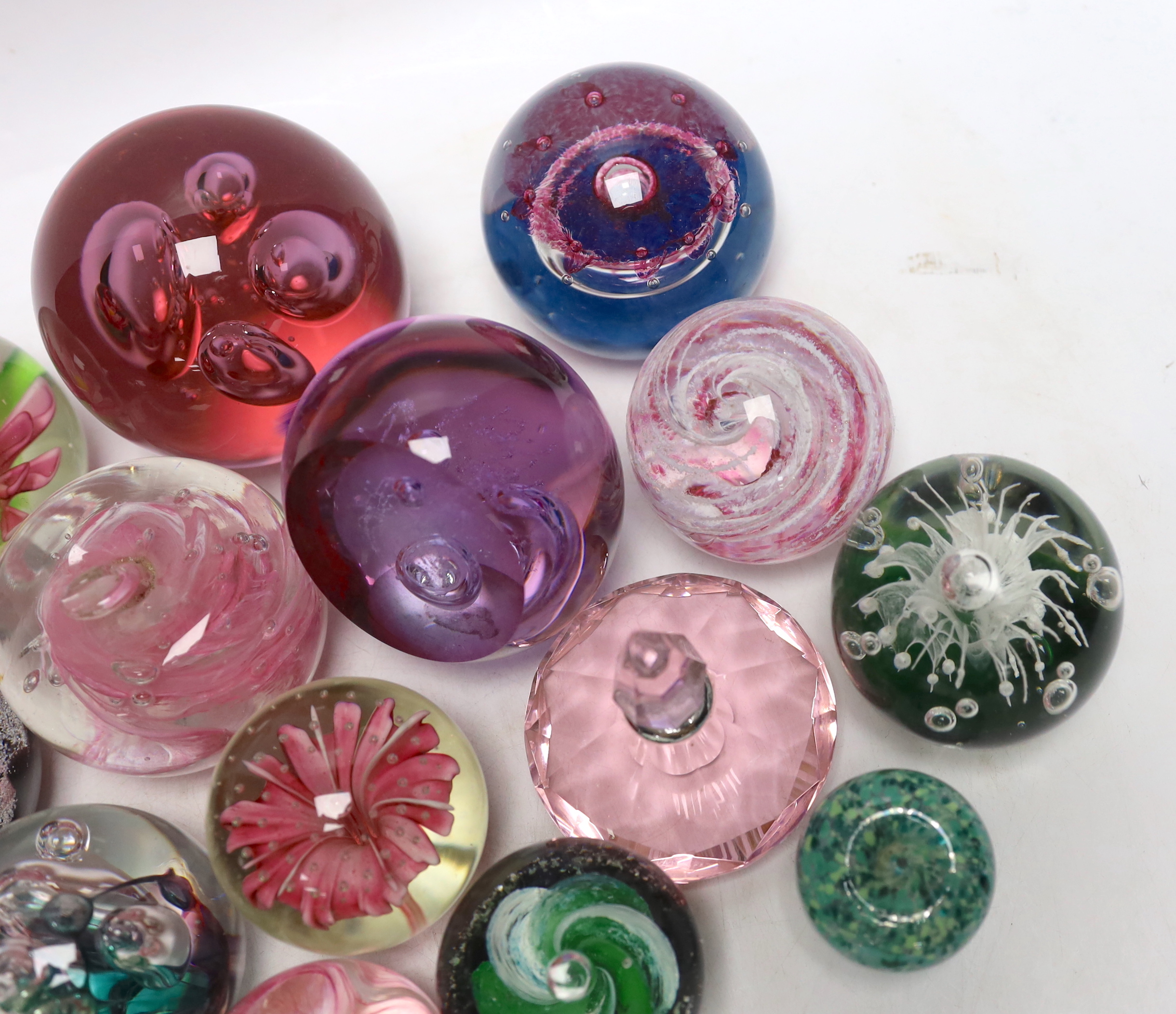 A group of glass paperweights including Caithness